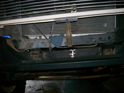 1989 Ford Bronco - The front end of a 1989 Ford Bronco shows its grille and radiator, viewed from an undercarriage angle.