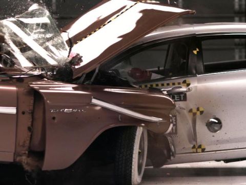 1971 Ford Ranchero - This image captures the aftermath of a vehicle crash test, showing significant damage to both cars involved.