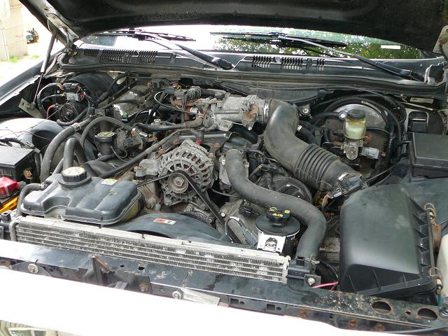 2003 Ford Crown Victoria engine bay with radiator and air intake visible