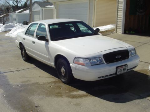2003 Ford Crown Victoria - After a few cosmetic changes. Swapped out chrome grille for black honeycomb grille, and slapped on some center caps.