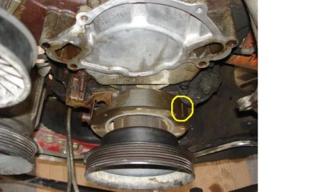 1992 Ford Bronco - Close-up view of an engine's pulley system and water pump assembly.