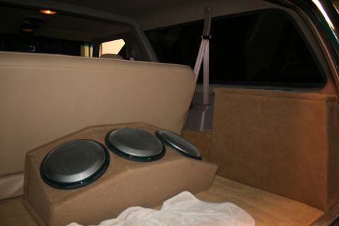 1995 Ford Bronco - Custom speaker box with three speakers installed in the cargo area of a vehicle.