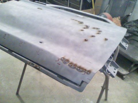 1979 Ford F-250 - A car door, possibly from a 1979 Ford F-250, is shown with visible weld marks and handwritten measurements.