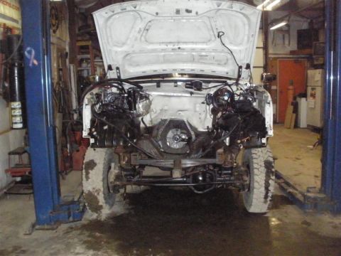 1994 Ford F-350 - This truck is in a garage undergoing repairs with its engine removed.