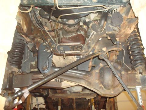 1995 Ford Bronco - A view of the vehicle's undercarriage, showing suspension and drivetrain parts.