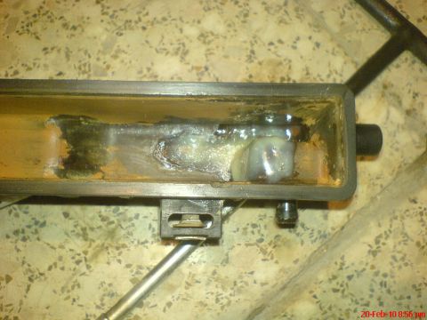 1998 Ford Crown Victoria - A close-up view of a corroded metal component, possibly from a vehicle's cooling system.