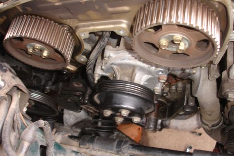 1995 Ford Taurus - This image shows the internal engine components, specifically the timing belt pulleys and water pump, not the exterior of a vehicle.