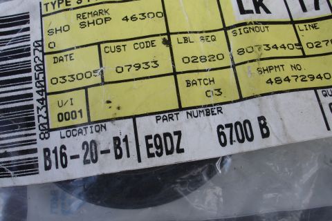 1995 Ford Taurus - Close-up of a part label with barcode and various codes and numbers.