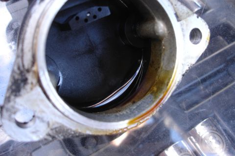 1995 Ford Taurus - Close-up view of an engine component with visible oil and internal mechanics.
