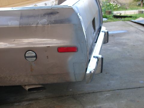 1973 Ford Ranchero - The rear of a 1972 Ford Ranchero shows a chrome bumper and a red taillight.