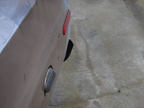 1973 Ford Ranchero - The rear of a 1973 Ford Ranchero is visible, showing its distinctive taillight and fuel door.