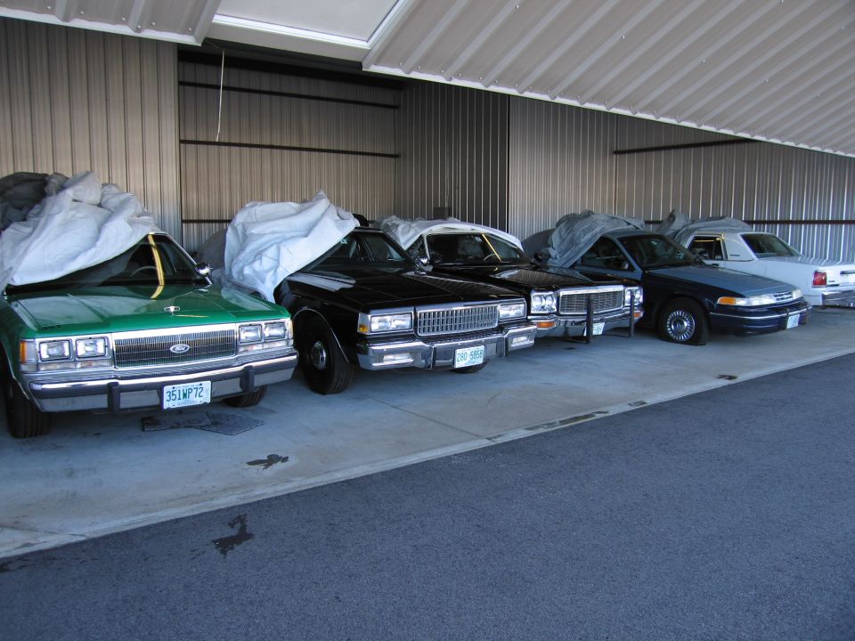 Green 1990 Ford Crown Victoria with a license plate reading 351W P72