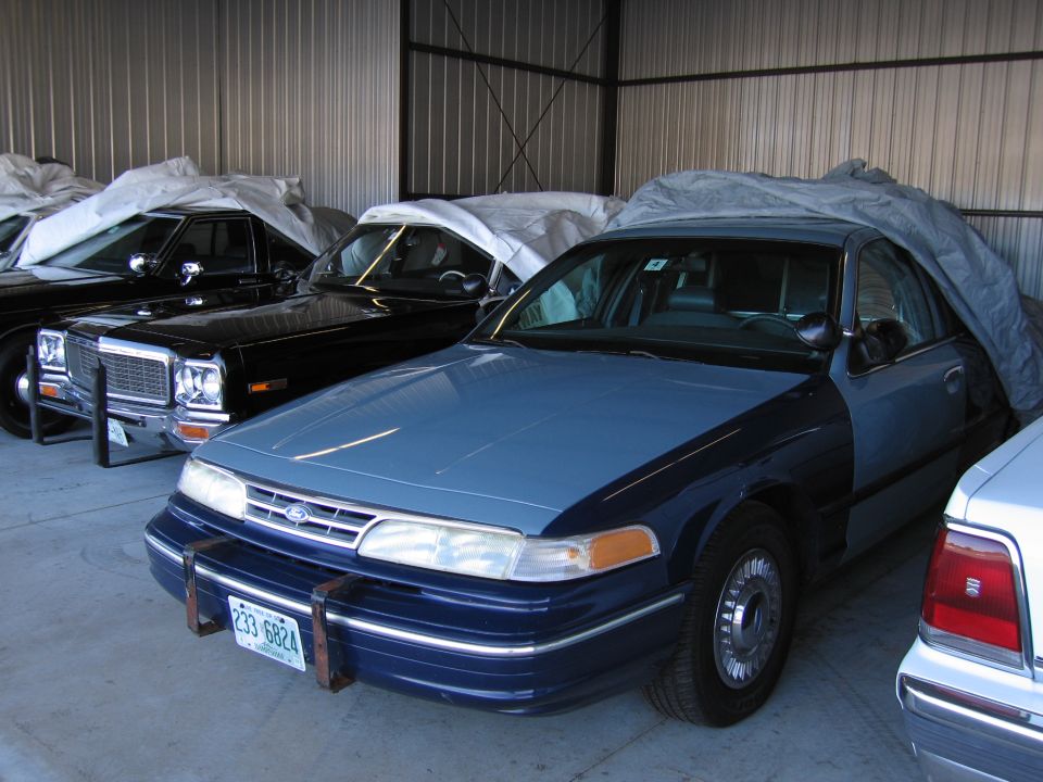 Blue and dark blue 1991 Ford Crown Victoria front quarter view with license plate 233 6824