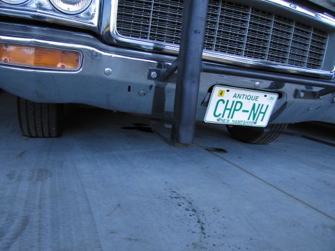 1991 Ford LTD Crown Victoria - Close-up of a car's front end, showing the bumper, grille, and license plate.