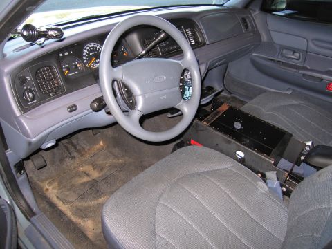 1991 Ford LTD Crown Victoria - Interior view of a 1991 Ford Crown Victoria LTD, showing the dashboard, steering wheel, and front seats.