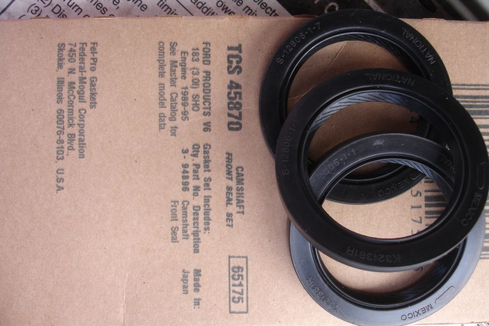 Camshaft front seal set on cardboard packaging, showing part numbers and vehicle fitment for Ford V6 engines 1989-95
