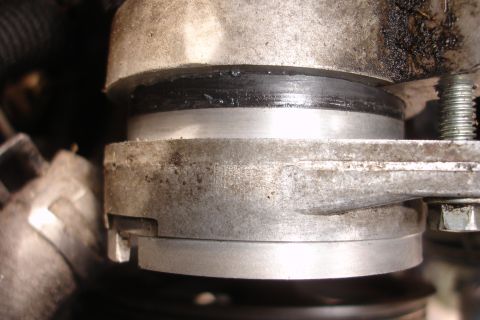 1995 Ford Taurus - Engine component a rubber seal, likely a cam seal, showing signs of wear and oil residue.