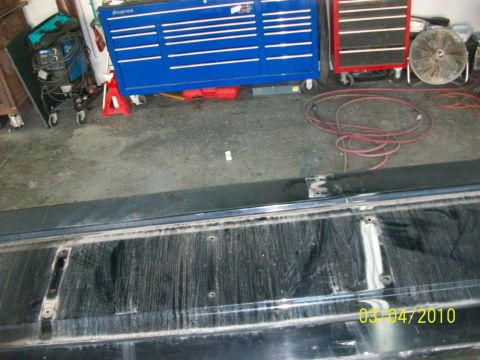 1985 Ford Bronco - The interior of a black tailgate is shown, with a date stamp indicating it was photographed on March 4, 2010.