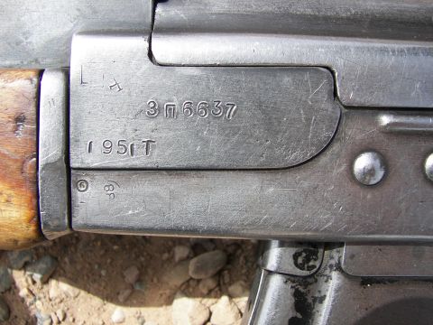 2000 Ford Crown Victoria - Firearm receiver details with visible serial numbers and markings.