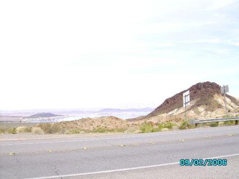 1978 Ford Bronco - A view of a desert landscape with a road and a distant body of water, captured on 09/02/2006.