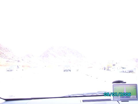 1978 Ford Bronco - A GPS unit displays the date 09/02/2006 in a vehicle driving through a desert landscape.