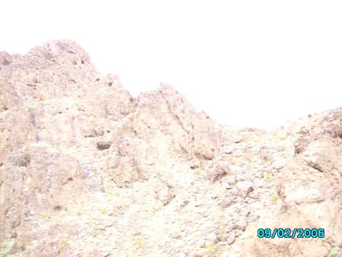 1978 Ford Bronco - A rocky hillside under a bright sky, with a date stamp visible.