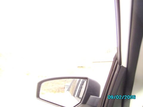 1978 Ford Bronco - View from inside a vehicle shows a side mirror reflecting a road and landscape. The photo is dated September 2, 2006.
