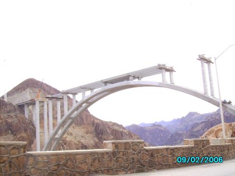1978 Ford Bronco - A bridge is under construction over a mountainous terrain, with a date stamp of 09/02/2006 visible.