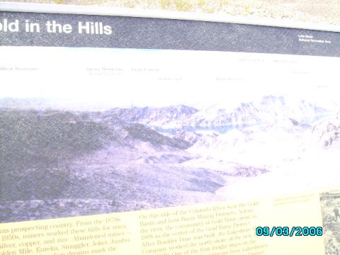 1978 Ford Bronco - An interpretive sign displays a panoramic view of mountains and lakes, accompanied by historical text about mining and the area'Gold Butte…