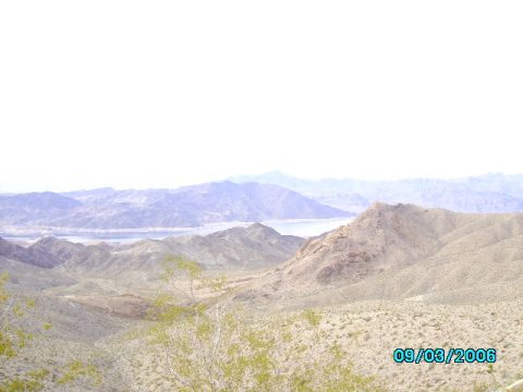 1978 Ford Bronco - Desert landscape with mountains and a body of water, dated 09/03/2006.