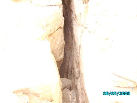 1978 Ford Bronco - A narrow crevice in a rock formation, with a date stamp of 09/03/2006 visible in the lower right corner.