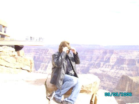 1978 Ford Bronco - Grand Canyon vista with a person seated on a rock ledge.