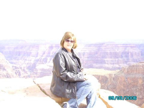 1978 Ford Bronco - A woman enjoys the view of a grand canyon, with a date stamp of 09/03/2006 visible.