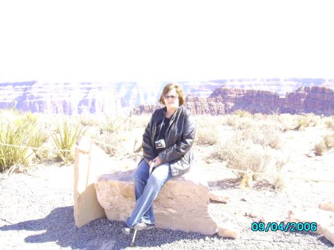 1978 Ford Bronco - A woman sits on a rock with a scenic canyon view, dated 09/04/2006.