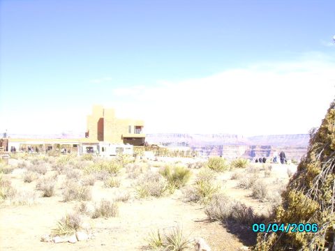 1978 Ford Bronco - A view of a building and the Grand Canyon landscape under a clear blue sky.