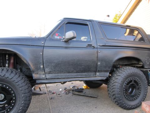 1996 Ford Bronco - This modified Ford Bronco appears to be from the early to mid-1990s, with significant off-road upgrades visible.