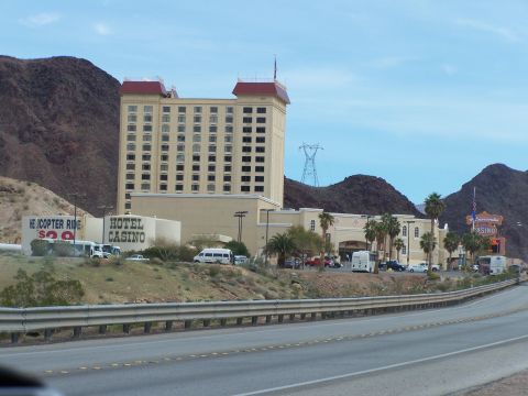 1978 Ford Bronco - Hotel and casino complex situated in a mountainous desert landscape.