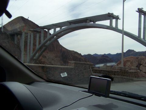 1978 Ford Bronco - View from inside a vehicle shows a bridge under construction with a GPS unit on the dashboard.