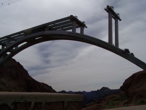 1978 Ford Bronco - A bridge is under construction over a rocky canyon landscape.