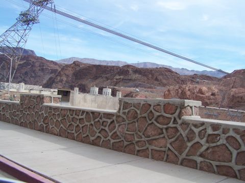 1978 Ford Bronco - A view of Hoover Dam and the surrounding arid landscape, with power lines overhead.