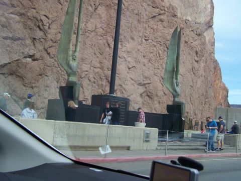 1978 Ford Bronco - A monument with statues and people is visible against a large rock formation.