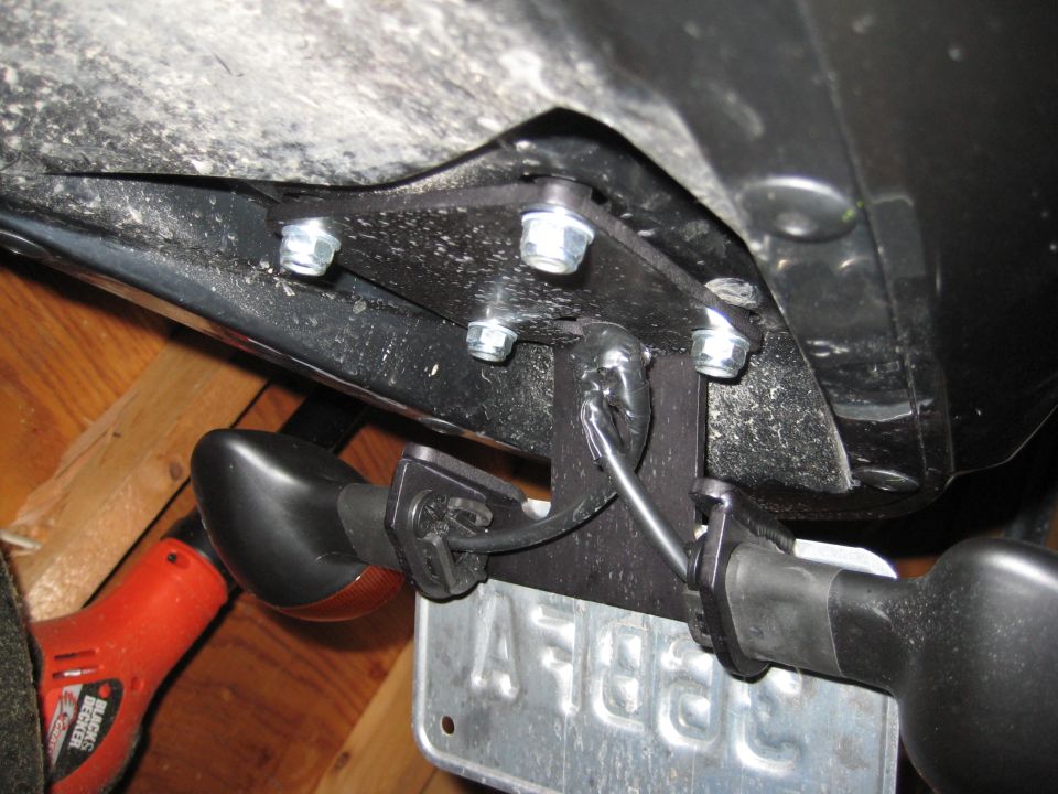 Motorcycle fender eliminator with black turn signals and license plate bracket