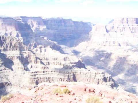 1978 Ford Bronco - The vast expanse of the Grand Canyon reveals its geological history through layered rock formations.
