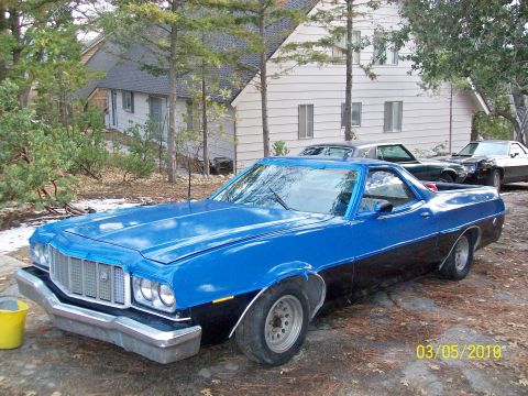 1973 Ford Ranchero - This 1973 Ford Ranchero features a distinctive blue and black two-tone paint scheme and a prominent grille.