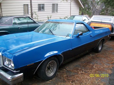 1973 Ford Ranchero - This 1973 Ford Ranchero is parked in a driveway with other vehicles visible.