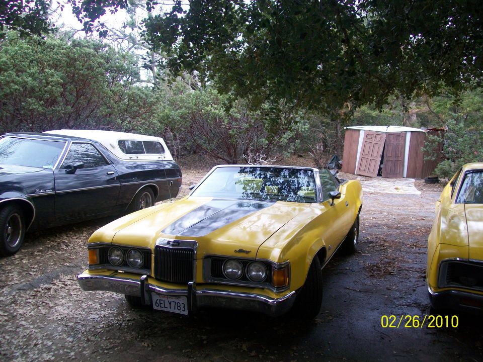 Yellow 1973 Mercury Cougar convertible with black stripes, front view, license plate 6ELY783