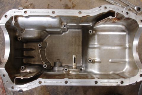 1993 Ford Taurus - This is a cleaned oil pan, likely removed for maintenance or repair.