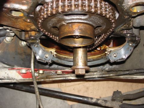 1992 Ford Bronco - Engine timing chain and gears assembly, showing wear and oil residue.