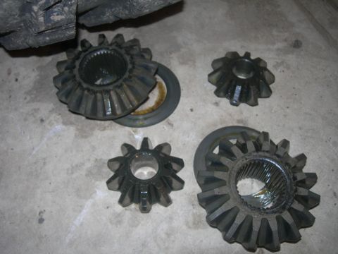 1991 Jeep Wrangler - Differential gears are shown on a concrete surface, likely components for a D60 axle swap.