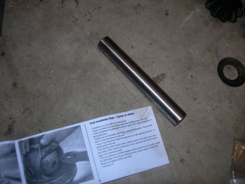 1991 Jeep Wrangler - Manual and parts for a differential locker installation are shown on a concrete floor.